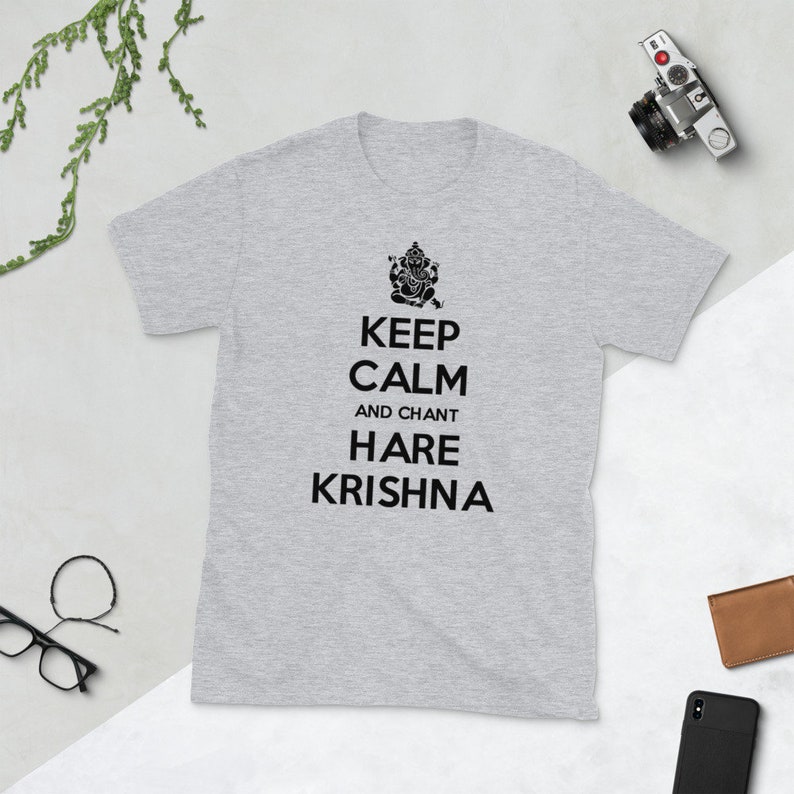 May include: A gray t-shirt with a black graphic of a Hindu deity and the text "Keep Calm and Chant Hare Krishna".