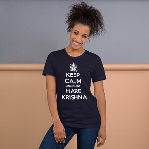May include: A navy blue t-shirt with a white graphic of a Hindu deity and the text "Keep Calm and Chant Hare Krishna".