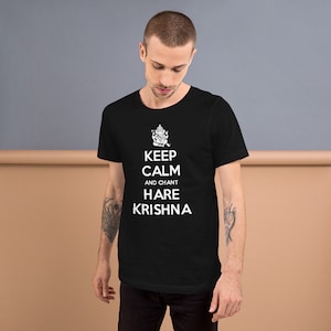May include: Black t-shirt with a white graphic that says "Keep Calm and Chant Hare Krishna" with a small image of a Hindu deity above the text.