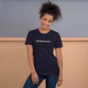 May include: A navy blue t-shirt with white text that reads "ABCDEFUCKOFF".