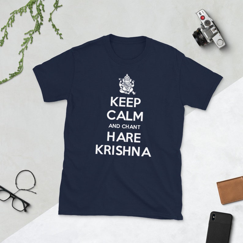 May include: Navy blue t-shirt with a white graphic of a Hindu deity and the text "Keep Calm and Chant Hare Krishna".
