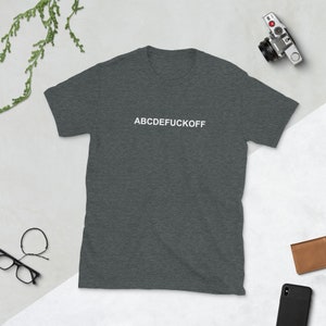 May include: A dark heather grey t-shirt with the text "ABCDEFUCKOFF" printed in white on the front.