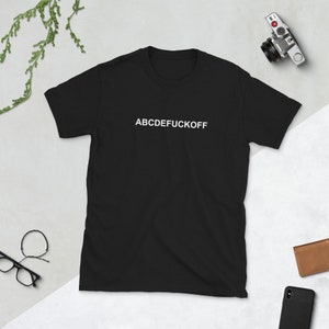 May include: Black t-shirt with white text that reads "ABCDEFUCKOFF".