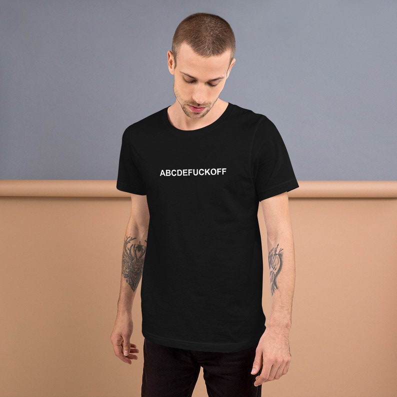 May include: A black t-shirt with the text "ABCDEFUCKOFF" printed in white on the front.