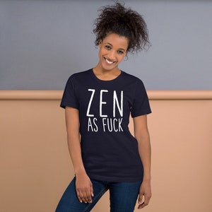 May include: A navy blue t-shirt with white text that reads "ZEN AS FUCK".