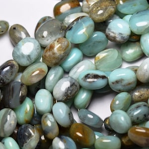 May include: A strand of oval-shaped, blue-green opal beads with brown and black markings. The beads are smooth and polished.
