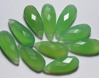 May include: Ten green gemstone teardrop pendants with faceted surfaces. The pendants have a hole at the top for stringing.