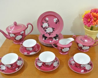 Nippon Noritake Toki Kaisha Porcelain Fine China Tea Set Rich Pink Color with a White Peony Blossoms Pattern and Gold Trim.