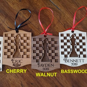Chess Ornaments can be personalized with up to 3 lines of text. These engraved, wooden ornaments are approx. 3in x 4in and come with choice of ribbon colors. Buy engraved chess ornaments for an entire team too. Email us about chess team ornaments.