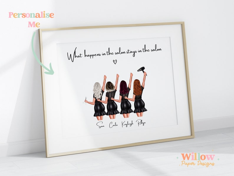 May include: A white framed print with a black and white illustration of four women in a salon setting. The text "What happens in the salon stays in the salon" is at the top of the print. The names "San, Cala, Kayleigh, Ray" are written below the illustration.