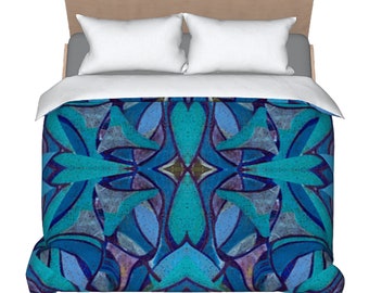 May include: King size duvet cover with a blue and teal abstract geometric pattern. The pattern is symmetrical and features a central diamond shape.