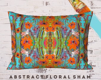 May include: A turquoise and orange abstract floral pillow sham with a standard size. The pillow sham features a symmetrical design with a repeating pattern of flowers and leaves.