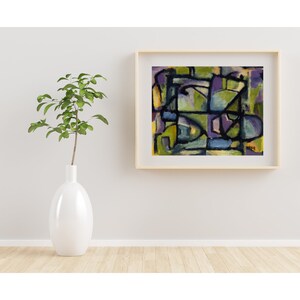 May include: Abstract painting in a wooden frame. The painting features geometric shapes in shades of green, blue, purple, and yellow.