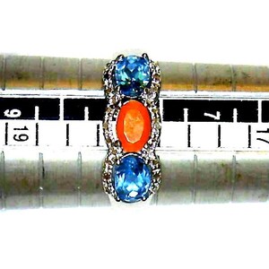 3 Gemstone Ring, Carnelian center stone with Swiss Blue Topaz on either side, set in 925, sterling Silver tapered band