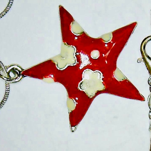 A Rich Red Enameled Star with white Puffy Clouds Charm, 29mm suspended from either an 18 inch 1mm Silverplate snake chain or snake bracelet