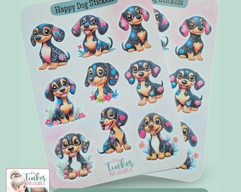 Pode incluir: Duas folhas de adesivos com nove adesivos cada, com cachorros-salsicha de desenho animado. Os adesivos têm um esquema de cores rosa e azul, com o texto "Happy Dog Stickers" no topo. Os adesivos são de "My Tinker Treasures".