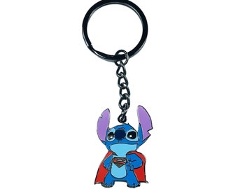 May include: A blue Stitch character wearing a red Superman cape keychain with a silver metal ring.