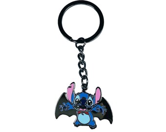 May include: A black metal keychain featuring a blue Stitch character with pink ears, wearing a red bow tie and black bat wings.