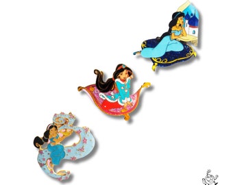 May include: Three Disney Aladdin-themed enamel pins featuring Jasmine on a magic carpet. The first pin shows Jasmine in a blue outfit, the second pin shows Jasmine in a pink outfit, and the third pin shows Jasmine in a blue outfit with a genie lamp.