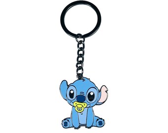 May include: A blue Stitch keychain with a pacifier. The keychain is made of metal and has a black chain.