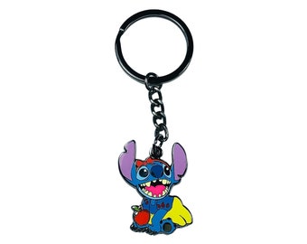 May include: A blue Stitch keychain with a red bow and a yellow dress holding a red apple. The keychain is attached to a silver metal ring and chain.