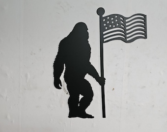 Bigfoot with Flag Metal Wall Art: Patriotic Sasquatch Cabin Decor