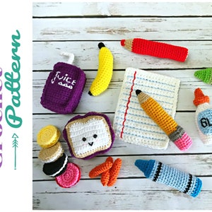 May include: Crochet pattern for a set of school supplies including a juice box, banana, sandwich, cookies, carrots, pencil, crayons, glue, and a sheet of paper.