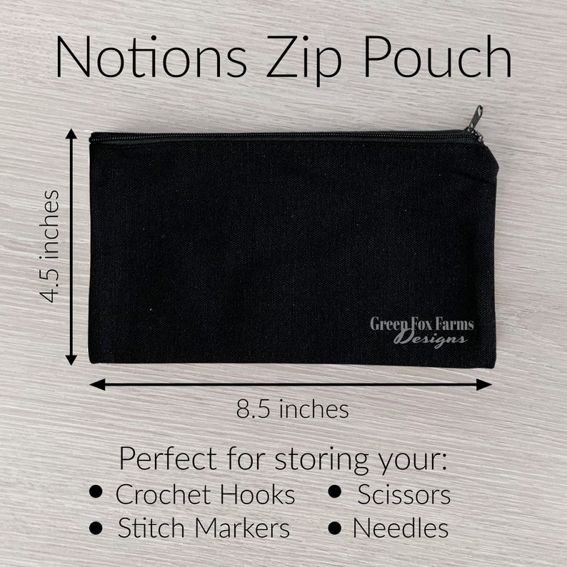 May include: Black zippered pouch with the text "Green Fox Farms Designs" printed on the front. The pouch measures 8.5 inches by 4.5 inches and is perfect for storing crochet hooks, scissors, stitch markers, and needles.