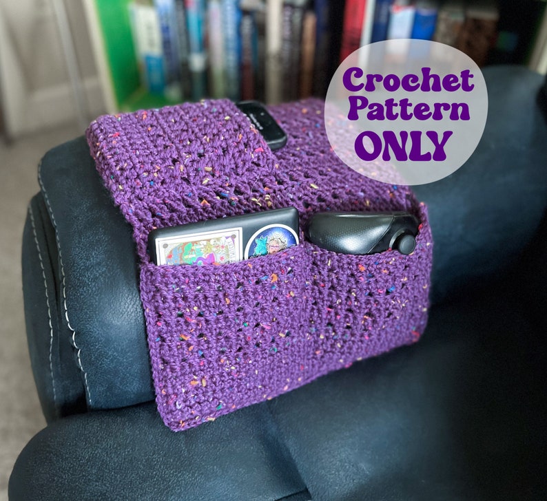May include: Purple crochet armrest organizer with pockets for a phone, remote, and other items. Crochet Pattern Only.