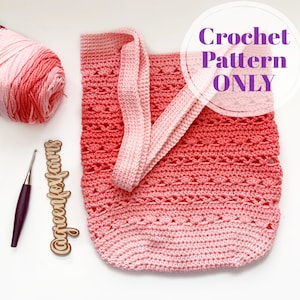 May include: A crochet pattern for a pink and red ombre tote bag with a crocheted handle. The pattern is available for purchase. "Crochet Pattern ONLY" is written in purple text on a white circle.