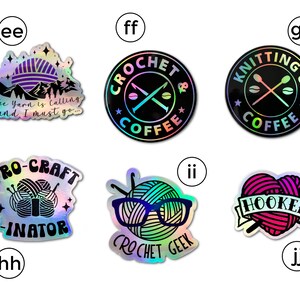 May include: Set of 10 iridescent holographic stickers featuring various designs related to knitting and crocheting. The stickers feature phrases like "Pro-Craft-inator", "Crochet Geek", "Knitting & Coffee", and "The Yarn is Calling and I Must Go..."