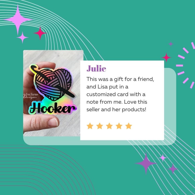 May include: A holographic sticker featuring a yarn ball and crochet hook, with the text "Hooker" in rainbow lettering. The sticker is held in a hand. The text "Jesigns" is visible in the background. The sticker was a gift for a friend, and the seller included a personalised card with a note. The seller received a five-star review from a customer named Julie.