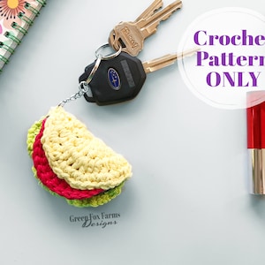 May include: Crochet pattern for a small, yellow, red and green taco keyring. The pattern is called "Green Fox Farms Designs".