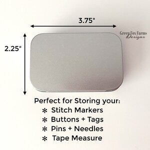 May include: A silver metal tin with rounded edges, measuring 3.75 inches by 2.25 inches. The tin is labeled "Green Fox Farms Designs" and is perfect for storing small items like stitch markers, buttons, tags, pins, needles, and tape measures.