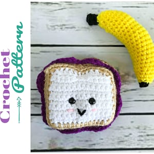 May include: A crocheted peanut butter and jelly sandwich with a smiling face and a crocheted banana. The sandwich is purple, brown, and white. The banana is yellow.