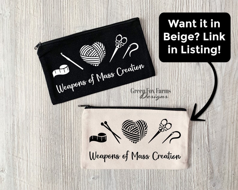 May include: Two zippered pouches with the text "Weapons of Mass Creation" and images of yarn, scissors, and needles. The pouch on the left is black and the pouch on the right is beige.