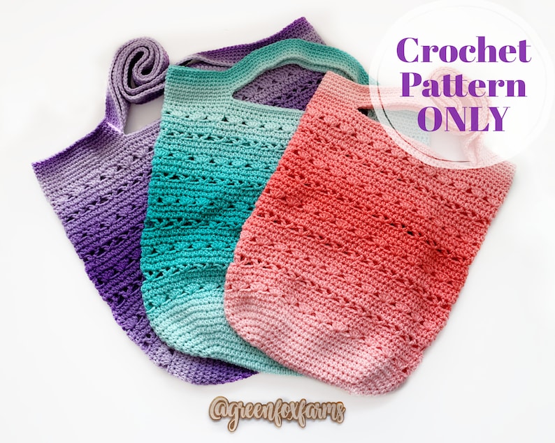 May include: Three crocheted bags in different color gradients: purple, teal, and pink. The bags have a simple, open-stitch design and are perfect for carrying groceries or other items. The image includes the text "Crochet Pattern ONLY".