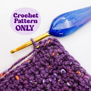 May include: A close-up of a purple crochet project with a gold crochet hook and a blue and white galaxy-themed crochet hook. The text "Crochet Pattern ONLY" is visible in the background.