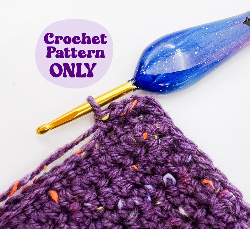 May include: A close-up of a purple crochet project with a gold crochet hook and a blue and white galaxy-themed crochet hook. The text "Crochet Pattern ONLY" is visible in the background.