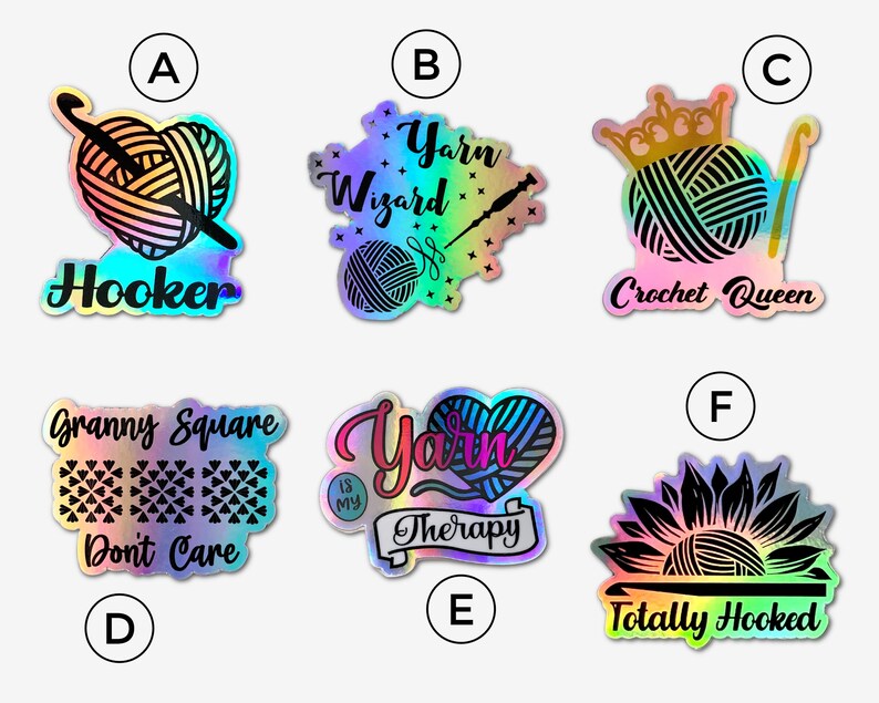 May include: Set of 6 iridescent vinyl stickers with various crochet and yarn themed designs. The stickers feature text such as "Yarn Wizard", "Hooker", "Crochet Queen", "Granny Square Don't Care", "Yarn is My Therapy", and "Totally Hooked".