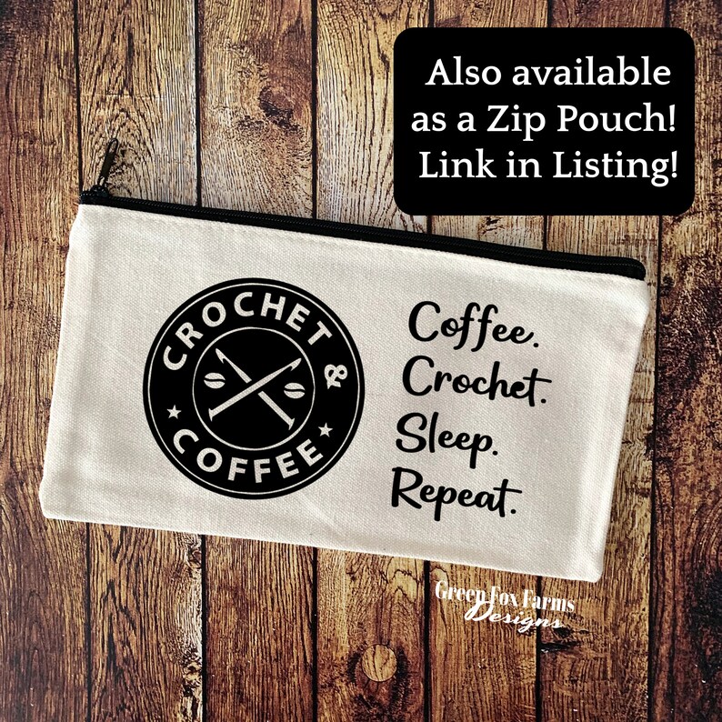 May include: A white canvas zippered pouch with a black circle logo that says "Crochet & Coffee" with a coffee bean and crossed crochet hooks. The text "Coffee. Crochet. Sleep. Repeat." is printed below the logo.