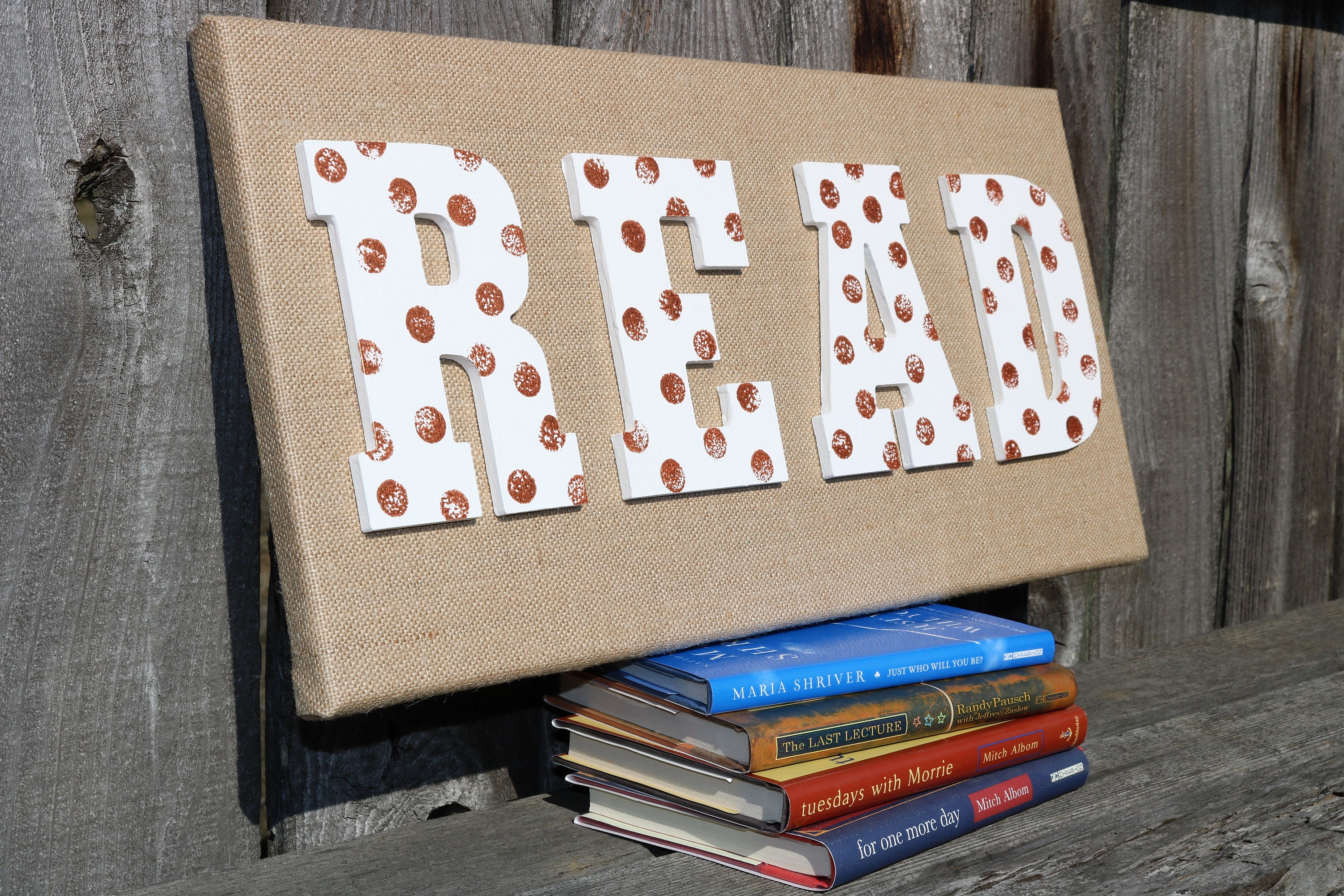 Inspire Reading Adventures With This Burlap Canvas With White Wooden Letters Spelling READ With