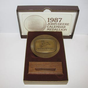 John Deere 1987 Bronze Calendar Medallion with the 1956 FOUR LEGGED Leaping Deer Trademark Logo 5th Series jd Backhoe Lawn Garden Tractor