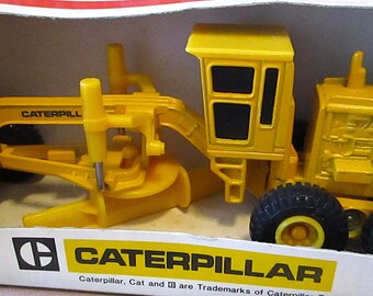 Mighty Movers Ertl Caterpillar CAT Motor Road Grader 1/64 Toy