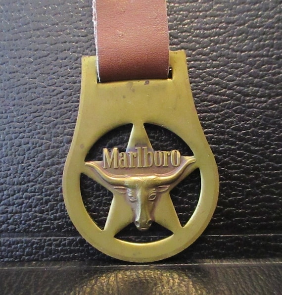 how much are cigarettes in texas today The Marlboro Brand Cigarettes Texas Longhorn Bull Cow Brass & Leather  Pocket Watch Fob Key Ring Philip Morris Advertising Promo Collectible