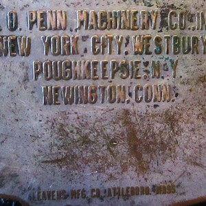 May include: Close-up of a metal plaque with the text "H.O. PENN MACHINERY CO. INC. NEW YORK CITY: WESTBURY. POUGHKEEPSIE, N.Y. NEWINGTON, CONN. ALEAVENS MFG. CO. ATTLEBORO, MASS."
