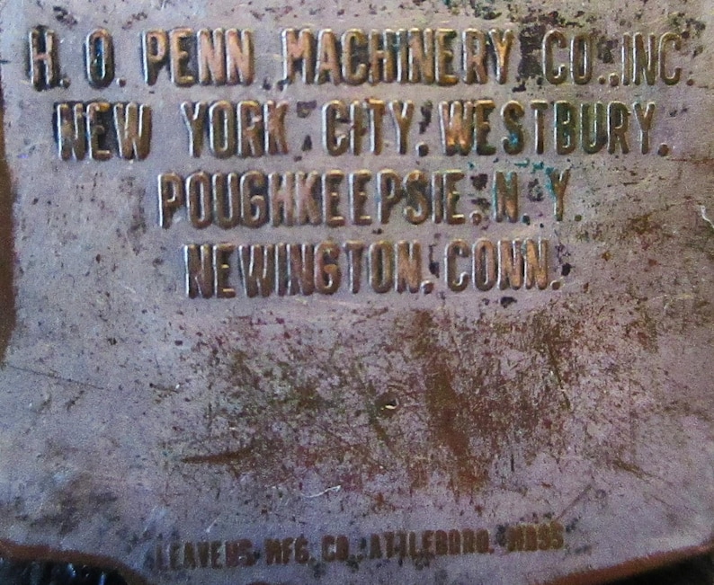May include: Close-up of a metal plaque with the text "H.O. PENN MACHINERY CO. INC. NEW YORK CITY: WESTBURY. POUGHKEEPSIE, N.Y. NEWINGTON, CONN. ALEAVENS MFG. CO. ATTLEBORO, MASS."