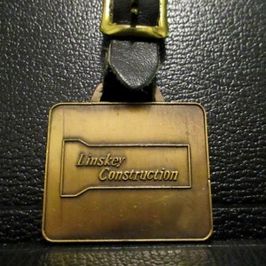 LINSKEY CONSTRUCTION Salem, Massachusetts General Contractors Pocket Watch Fob Hoe Ram Excavating Heavy Equipment Rentals Water Sewer