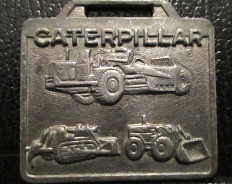 Caterpillar Cat Bandschaktare Bulldozer Skrapa Traktor Hjullastare Bygg Fickur Fickmärke Reklam Kampanj Tillverkare MACO Metal Arts Co.