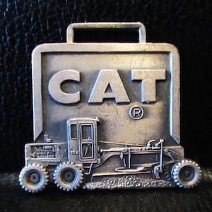Caterpillar CAT 12E Motor Road Grader Metal Pocket Watch Fob Construction Advertising Promo Witt-Armstrong Equipment Company MA & RI Leavens